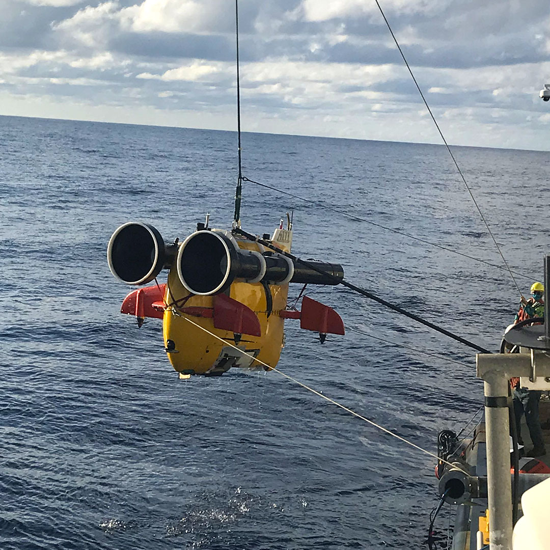 Mini submarine being lowered into ocean