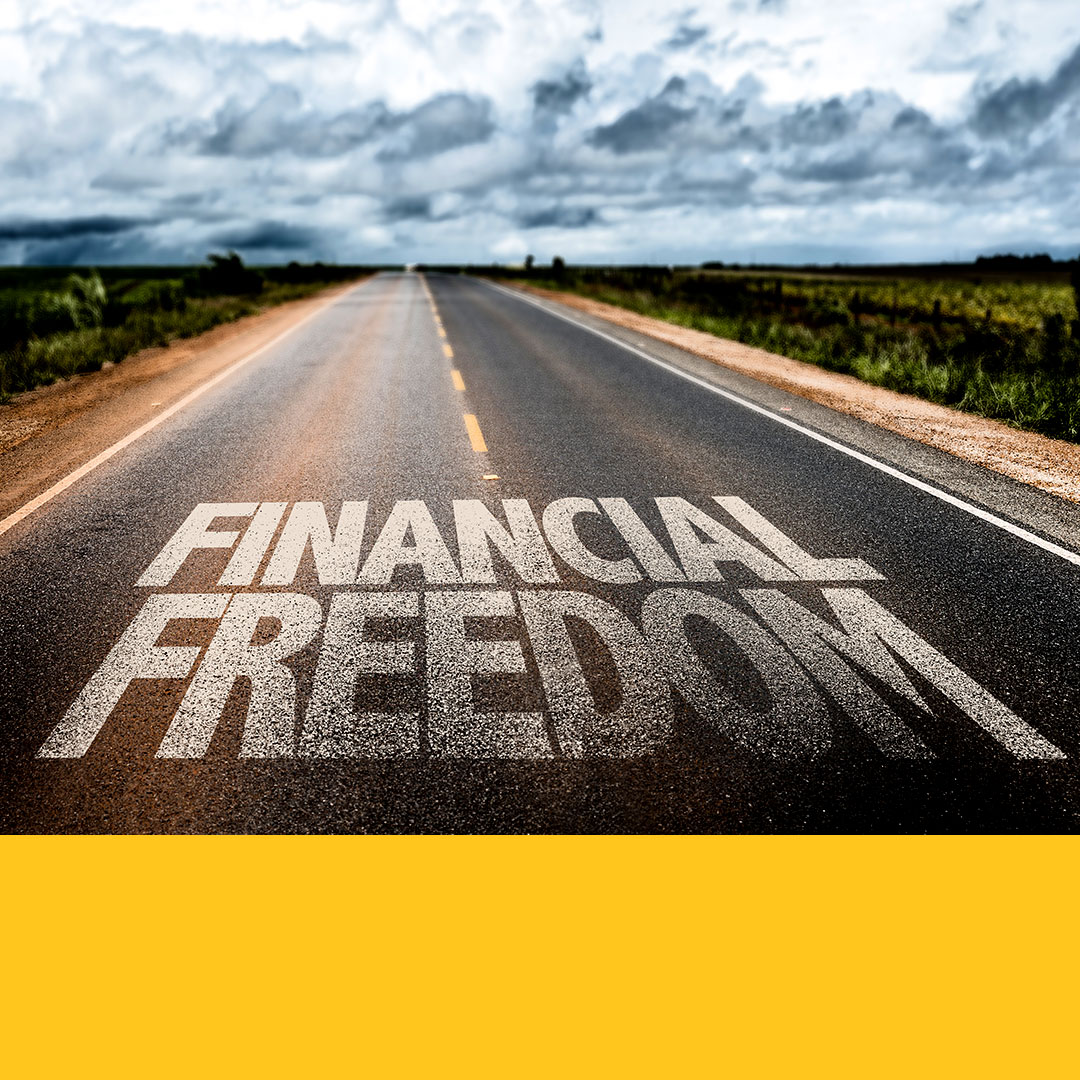Paved roadway leading to the horizon with the words financial freedom