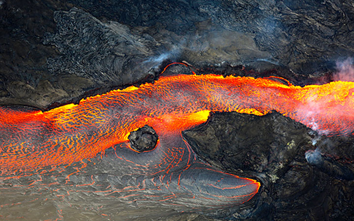 Aerial view of bright orange and red lava flow
