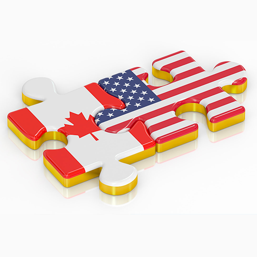 ALT TEXT:  Two interlocking puzzle pieces, one with the flag of Canada, the other with the flag of the United State