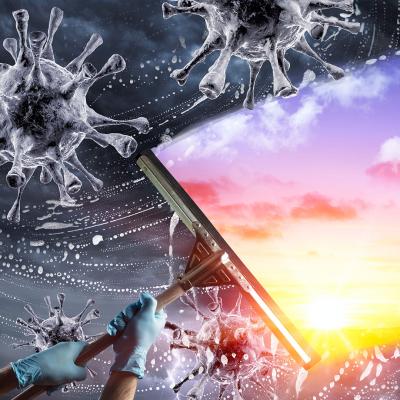 Viruses with a gray background being wiped by a person using a window wiper and wearing latex gloves exposing sunshine behind the viruses