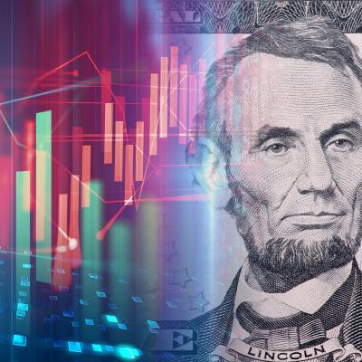 Colorful chart graph fading to Abe Lincoln five dollar bill