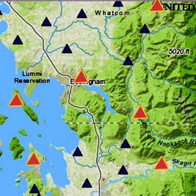 Seismographic map of Washington state with red and blue triangles showing seismic activity