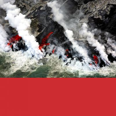Aerial view of rugged coastline with billowing steam and bright red lava flows