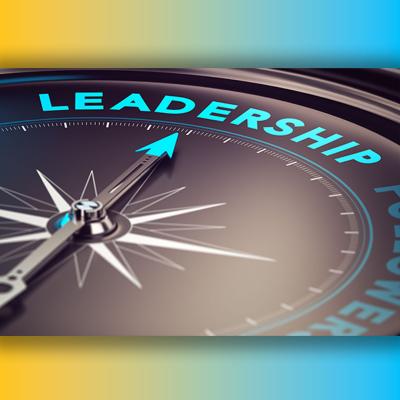 A compass needle with a bright blue tip points toward the word LEADERSHIP.