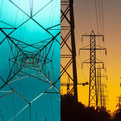 Detail of a high-power transmission tower against a greenish blue sky and power lines against a dusky sunset.