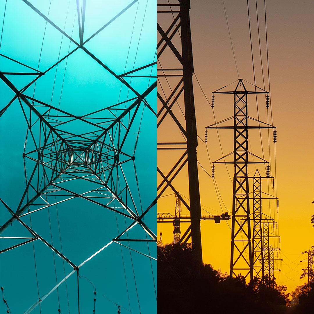 Detail of a high-power transmission tower against a greenish blue sky and power lines against a dusky sunset.
